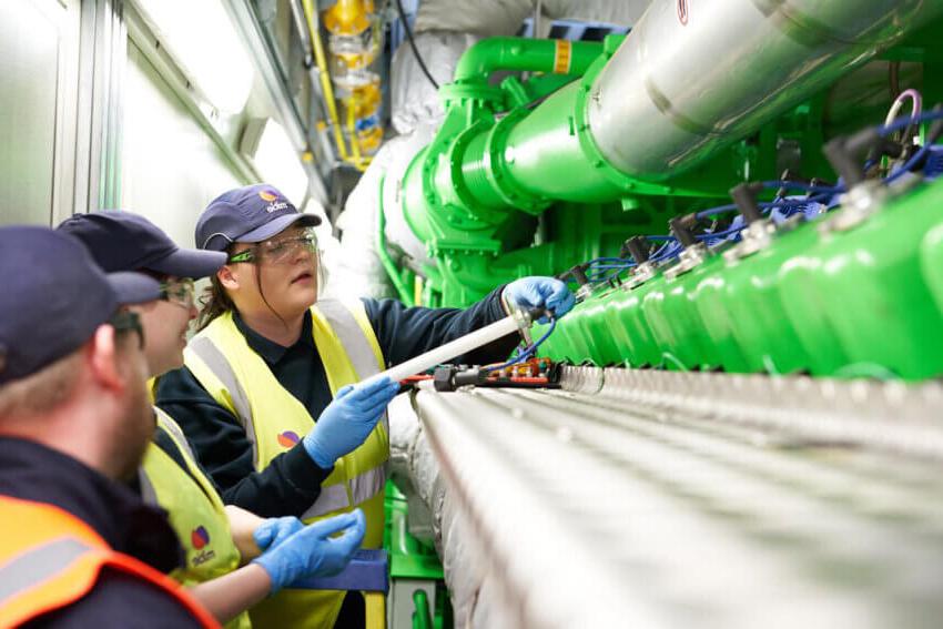 Mitie female engineers working on a pipe system